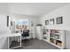 Well-lit office space featuring crisp white walls, a large window, and custom shelving units at 6725 Lionshead Pkwy, Lone Tree, CO 80124