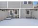 Snow-covered backyard with private access and a small patio at 6712 E Briarwood Dr, Centennial, CO 80112