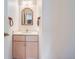 Small bathroom with vanity and mirror at 6712 E Briarwood Dr, Centennial, CO 80112