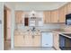 Kitchen with pass-through to dining area at 6712 E Briarwood Dr, Centennial, CO 80112