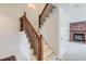 Elegant wooden staircase leading to the upper level at 6712 E Briarwood Dr, Centennial, CO 80112