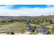 Panoramic aerial view of the house nestled in a neighborhood with mountain views and blue sky at 1076 Switch Grass Dr, Castle Rock, CO 80109
