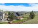 Aerial view of the home showcasing the backyard, patio area, landscaping, and surrounding greenery and scenery at 1076 Switch Grass Dr, Castle Rock, CO 80109