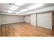 Finished basement area with recessed lighting and freshly refinished wood flooring at 1076 Switch Grass Dr, Castle Rock, CO 80109