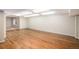 Spacious basement showcasing new hardwood floors and bright lighting at 1076 Switch Grass Dr, Castle Rock, CO 80109