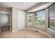 Sunlit breakfast nook featuring tile flooring, large windows and views of the outside at 1076 Switch Grass Dr, Castle Rock, CO 80109