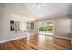 Open floor plan features hardwood floors, a kitchen view, and access to the backyard at 1076 Switch Grass Dr, Castle Rock, CO 80109