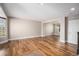Bright, open-concept living room with hardwood floors and dining room at 1076 Switch Grass Dr, Castle Rock, CO 80109