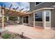 Outdoor patio area with pergola, swing and concrete flooring, perfect for outdoor relaxation and entertaining at 1076 Switch Grass Dr, Castle Rock, CO 80109