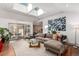 Bright living room featuring skylights, a comfortable sectional, and sliding glass doors to outdoor patio at 105 S Dexter St, Denver, CO 80246