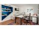 Bright office space with built-in shelving, a modern desk, and a comfortable chair at 105 S Dexter St, Denver, CO 80246