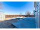 Spacious backyard featuring a patio area, fenced perimeter, and a shed for extra storage at 5747 E Monument Dr, Castle Rock, CO 80104