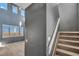 Bright entryway featuring stairs, high ceilings, and plenty of natural light from large windows with shutter blinds at 5747 E Monument Dr, Castle Rock, CO 80104