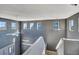 A tall stairwell with multiple windows allows ample light to enter the house at 5747 E Monument Dr, Castle Rock, CO 80104