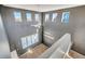 A high-ceiling with multiple windows provides ample natural light to this home at 5747 E Monument Dr, Castle Rock, CO 80104