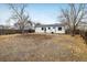 Large backyard with potential for landscaping and outdoor activities, surrounded by a wooden fence at 10792 Moore St, Broomfield, CO 80021