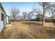 View of the expansive backyard with wooden fence, an ideal space for outdoor activities at 10792 Moore St, Broomfield, CO 80021