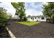 Spacious backyard featuring a well-manicured lawn, fresh mulch, and privacy fencing at 10792 Moore St, Broomfield, CO 80021
