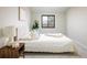 Bright bedroom featuring a large window and stylish decor with a wooden nightstand at 10792 Moore St, Broomfield, CO 80021