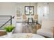 Cozy dining area featuring modern lighting, hardwood floors, and comfortable seating near the door to the backyard at 10792 Moore St, Broomfield, CO 80021