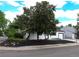 Well-maintained home exterior with white siding, black trim, and a landscaped front yard on a corner lot at 10792 Moore St, Broomfield, CO 80021
