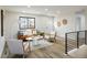Bright living room showcasing wood floors, comfortable seating, and recessed lighting at 10792 Moore St, Broomfield, CO 80021