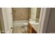 This bathroom features tile shower surround and vanity sink at 12170 Huron St # 106, Denver, CO 80234