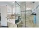 Bright bathroom showcasing a glass shower, soaking tub and designer tile and finishes at 38025 E 145Th Pl, Keenesburg, CO 80643