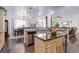 Spacious kitchen with an island, stainless steel appliances, and an adjacent dining area at 38025 E 145Th Pl, Keenesburg, CO 80643