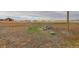 Expansive plot of land featuring a mix of grass and dry patches and a white fence boundary at 38025 E 145Th Pl, Keenesburg, CO 80643