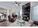 Open-concept living room with a stone fireplace, hardwood floors, and natural light at 38025 E 145Th Pl, Keenesburg, CO 80643