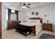 Cozy bedroom with carpet, a large bed, and traditional furnishings at 38025 E 145Th Pl, Keenesburg, CO 80643