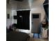 Bedroom with carpeted floors, ceiling fan, TV and door at 1375 N Iola St, Aurora, CO 80010
