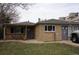 Charming single-story home with brick exterior, covered porch, and well-maintained front yard at 1375 N Iola St, Aurora, CO 80010