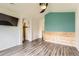 Spacious bedroom with hardwood flooring and TV at 12507 Dexter Way, Thornton, CO 80241