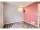 Cozy bedroom with unique wall colors, modern lighting, and stylish floors at 12507 Dexter Way, Thornton, CO 80241