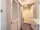 Hallway view with closet, washer and dryer, and cabinetry at 12507 Dexter Way, Thornton, CO 80241