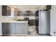 Spacious kitchen with stainless steel appliances, island, and modern cabinetry at 12507 Dexter Way, Thornton, CO 80241