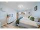 Bright and airy bedroom with a comfortable bed, fresh decor, and a large window at 10321 W 59Th Ave # 2, Arvada, CO 80004
