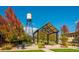 Outdoor space with a shaded pergola, seating, and lush landscaping, perfect for relaxation and community gatherings at 10321 W 59Th Ave # 2, Arvada, CO 80004