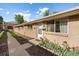 Charming home exterior featuring a brick facade, well-maintained yard, and inviting front entry at 10321 W 59Th Ave # 2, Arvada, CO 80004