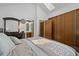 Bright bedroom showing a skylight, closet and dresser leading to the bathroom at 4020 E 94Th Ave # B, Thornton, CO 80229