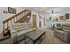 Inviting living room features a staircase, cozy seating, and an open layout at 4020 E 94Th Ave # B, Thornton, CO 80229