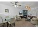 Bright living room with a cozy fireplace, large TV, and comfortable seating area at 4020 E 94Th Ave # B, Thornton, CO 80229