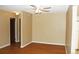 Bright living room featuring wood floors and ceiling fan connected to doorway at 14390 E Marina Dr # 204, Aurora, CO 80014