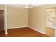 Bright living room with ceiling fan and wood floors and view to kitchen at 14390 E Marina Dr # 204, Aurora, CO 80014