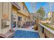 Inviting back deck area with a seating area, garden view, and peaceful outdoor setting at 18605 E Saratoga Pl, Aurora, CO 80015