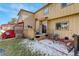 Charming backyard area with a patio, landscaped garden, and cozy seating at 18605 E Saratoga Pl, Aurora, CO 80015