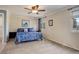 Bedroom featuring a ceiling fan, large window, soft carpet and neutral paint at 18605 E Saratoga Pl, Aurora, CO 80015