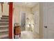 Welcoming entryway with hardwood floors, staircase, and a decorative console table at 18605 E Saratoga Pl, Aurora, CO 80015